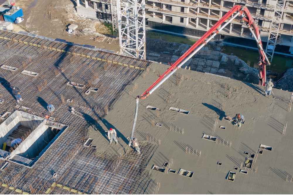 Pouring concrete on slab with a concrete pump